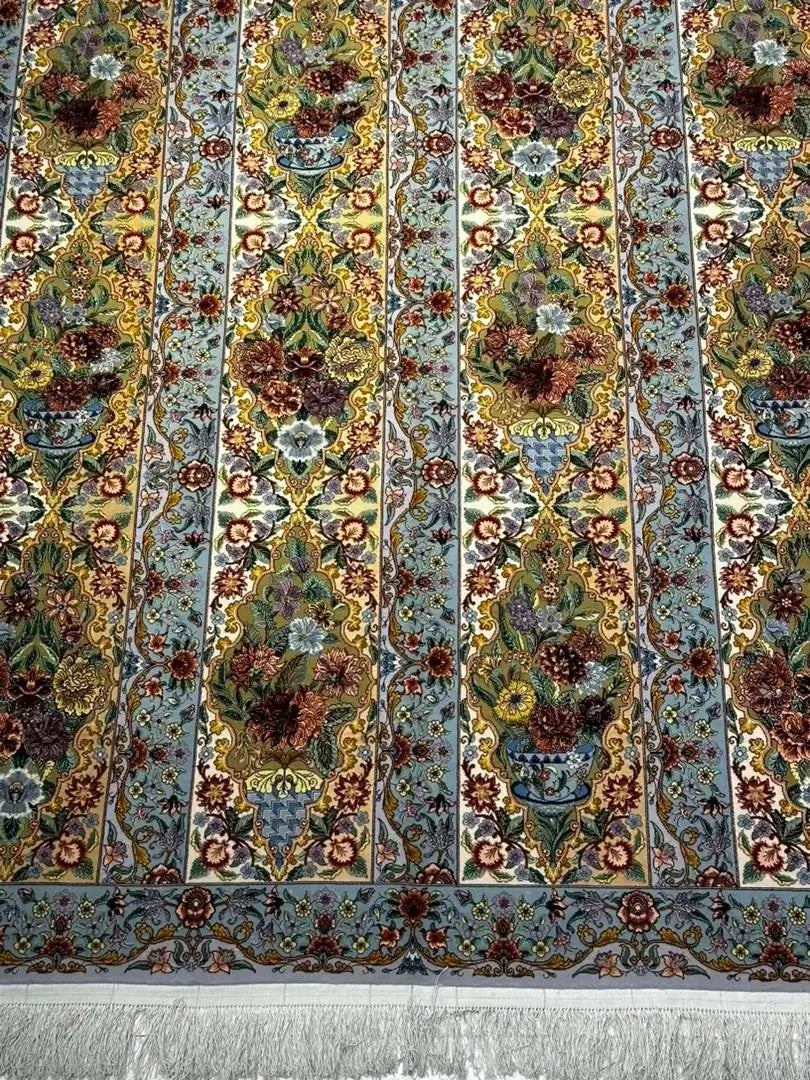 "Traditional Persian rug, silk and wool pile, hand-knotted for 1,000,000 knots per square meter."